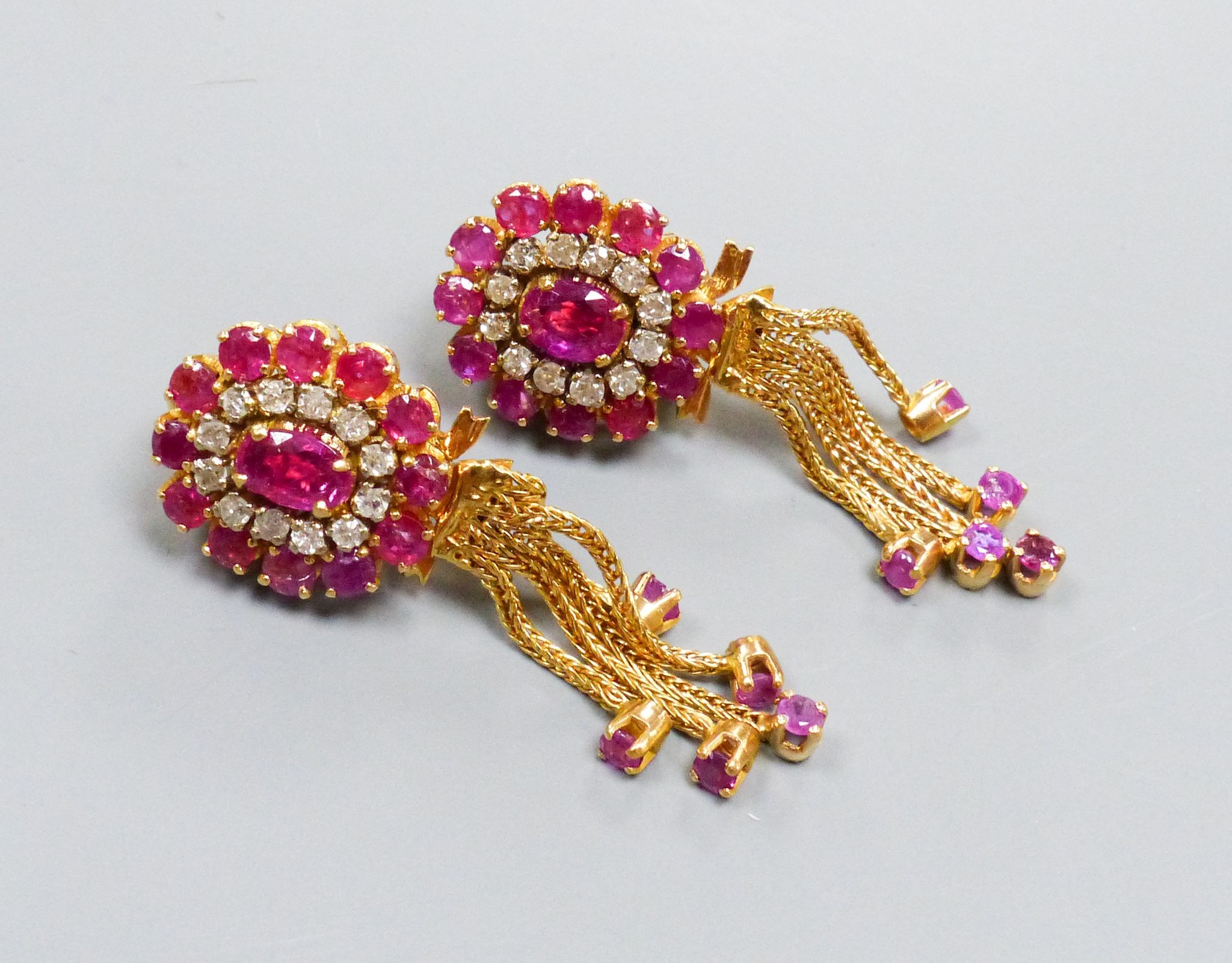 A pair of Indian yellow metal, ruby and diamond cluster earrings with detachable tassel drops, 43mm, gross weight 15.6 grams.